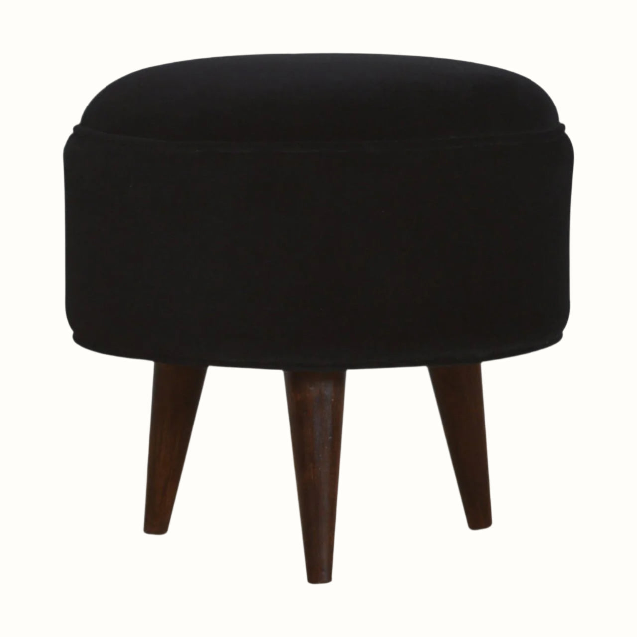 Circular footstool upholstered in black velvet, with dark wood legs.