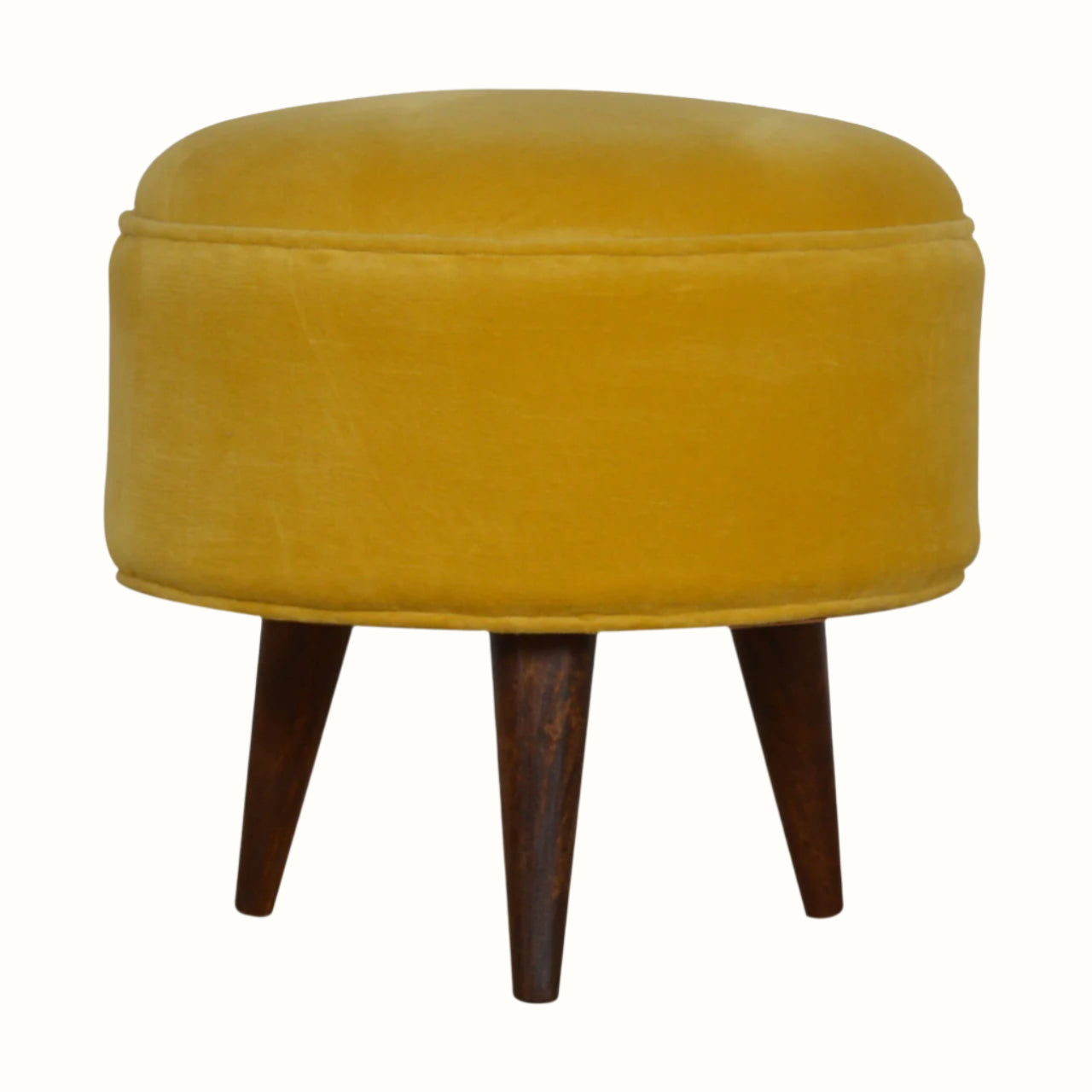Round wooden footstool upholstered in yellow velvet.