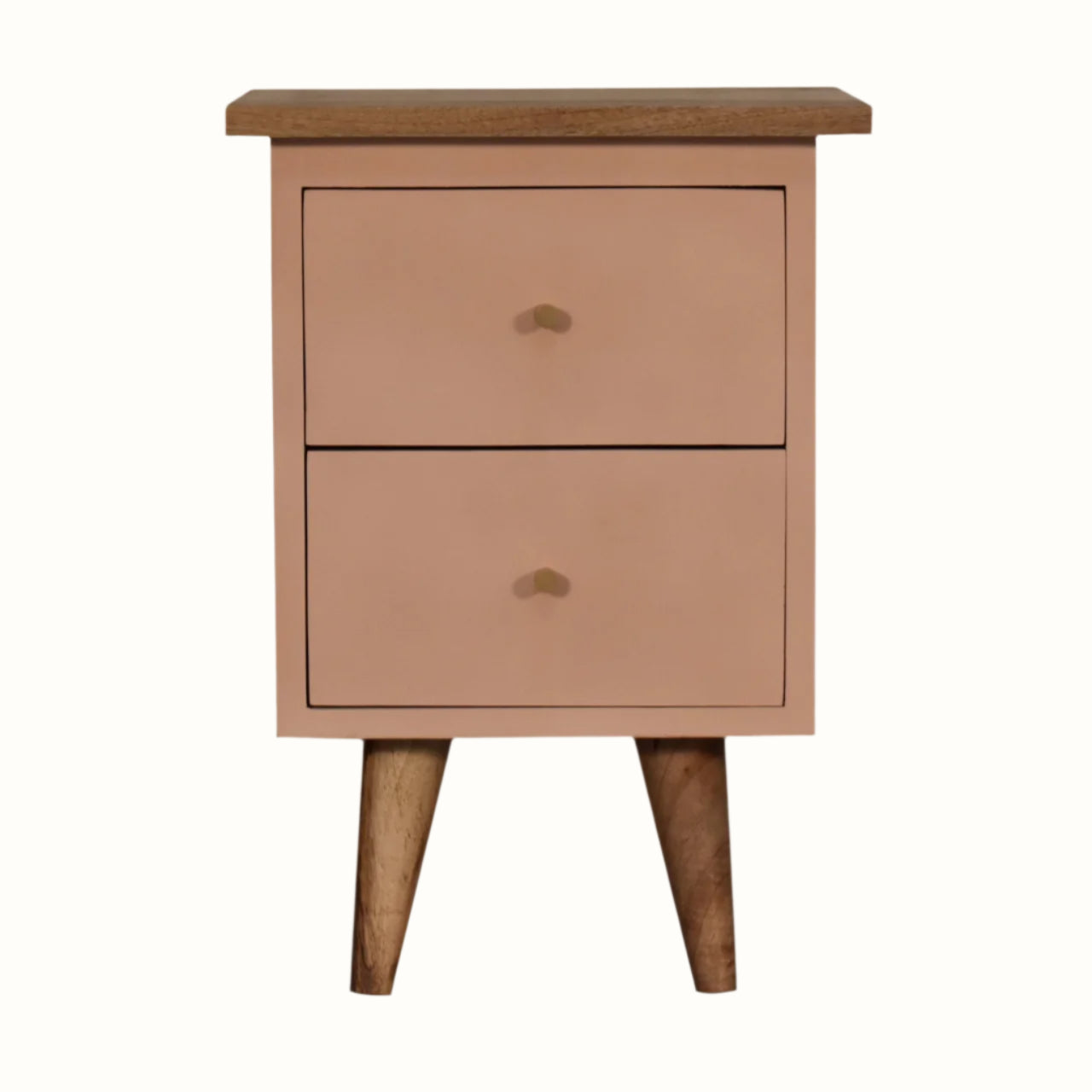 Handpainted bedside table made from solid wood, in a blush pink finish. Bedside features 2 drawers with brass hardware, and four short tapered legs.