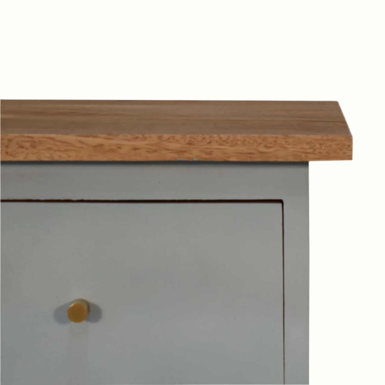 Close-up of a wooden cabinet with a light blue base and a small round knob.