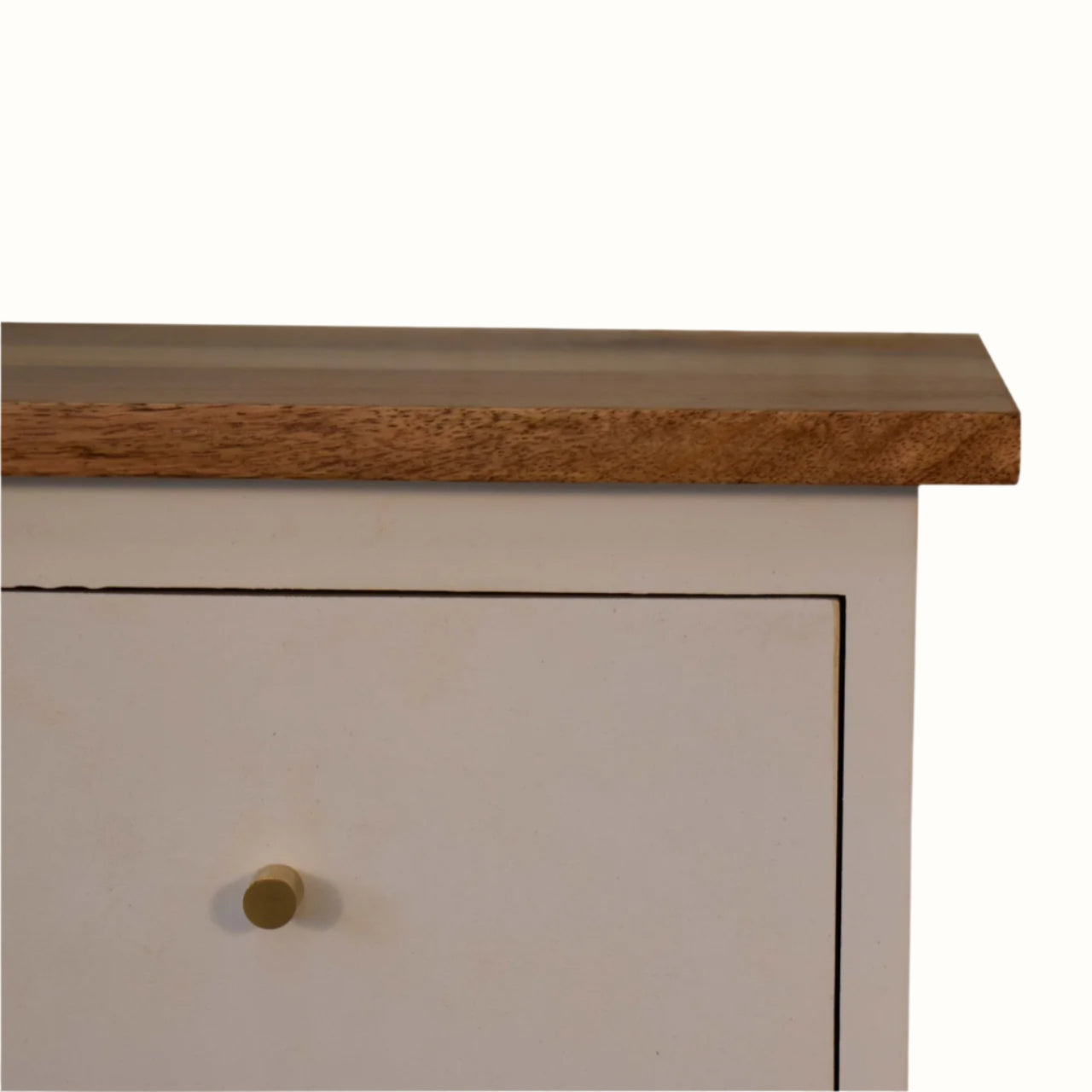 Close-up of a wooden cabinet with a white door and brass handle on a white background