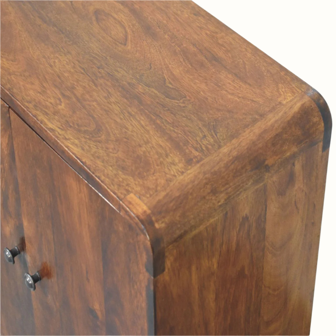 Close-up of a wooden cabinet with a focus on the texture and finish.