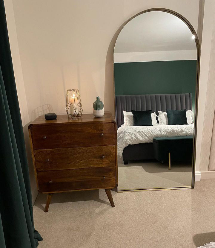Stylish bedroom featuring a dark wood chest of 3 drawers in a Mid Century Modern style.
