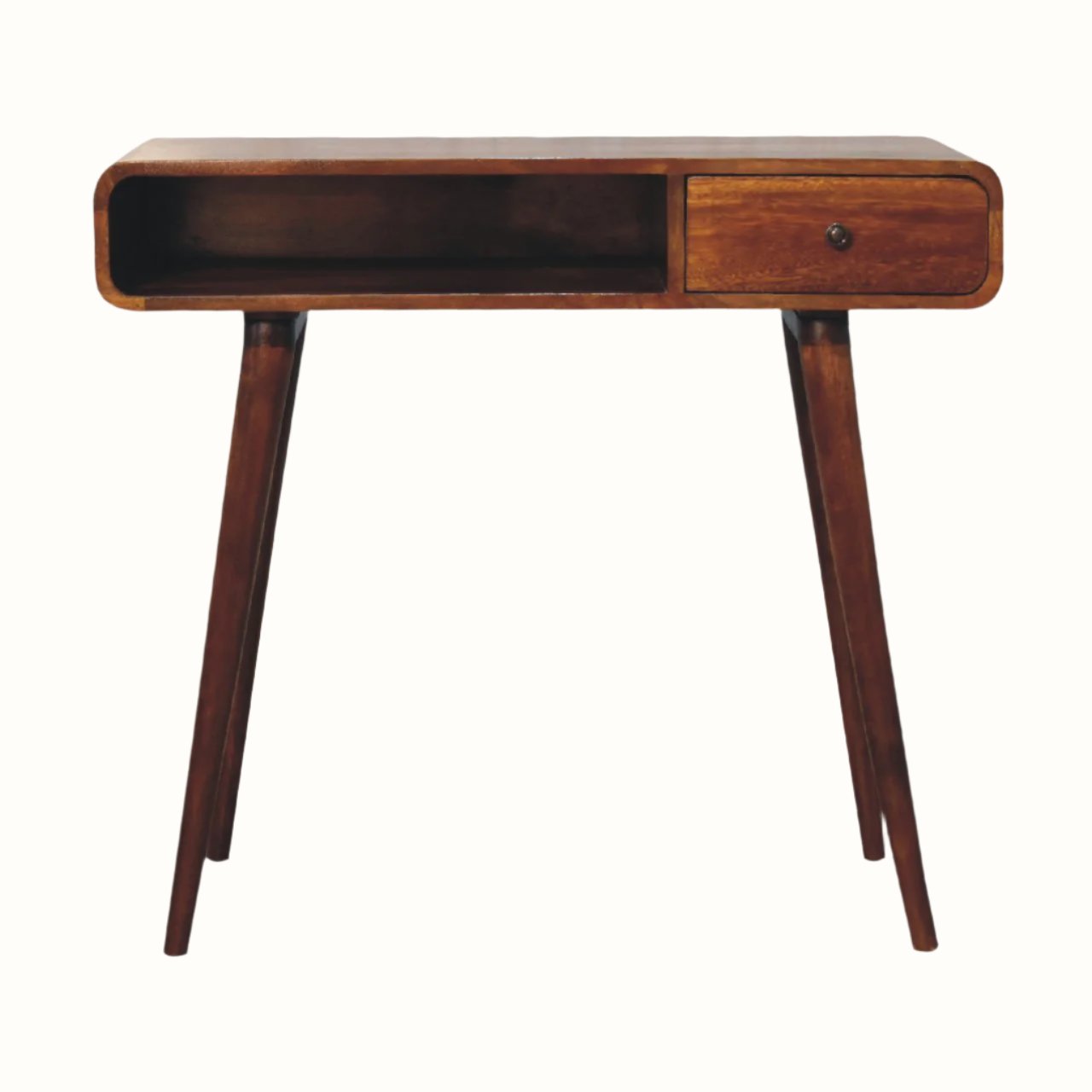 A chestnut-finished mango wood writing desk with four legs, one drawer with a brass knob, and an open slot shelf.