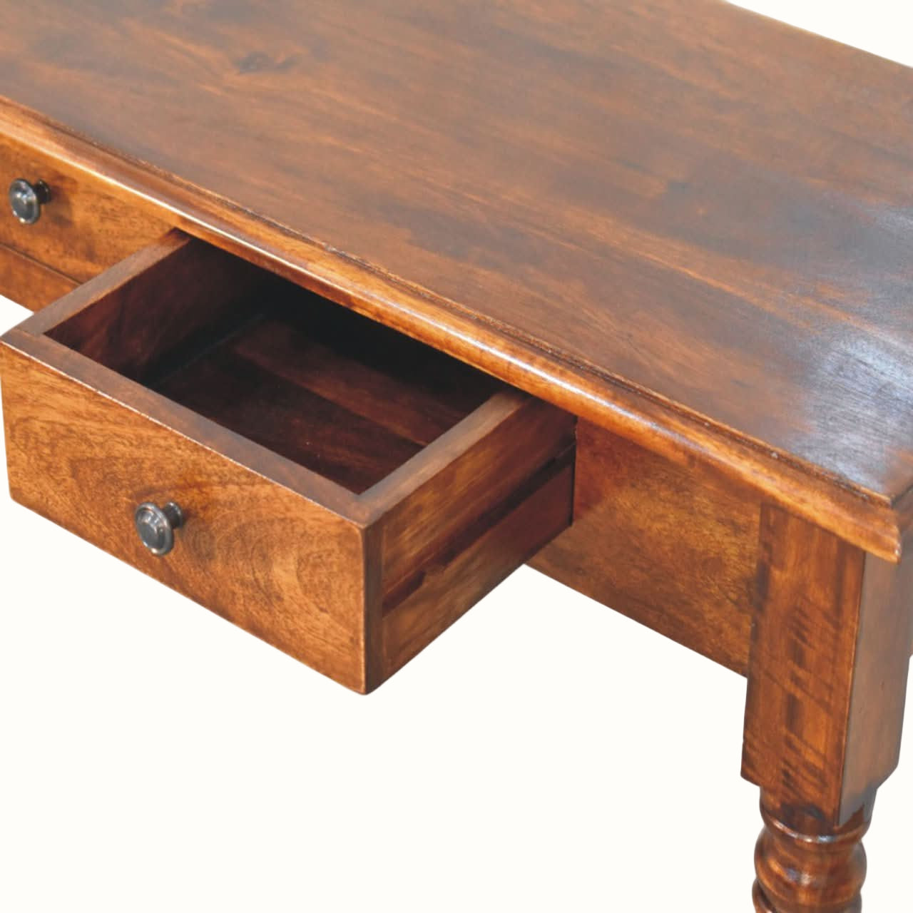 Wooden desk with an open drawer on a white background