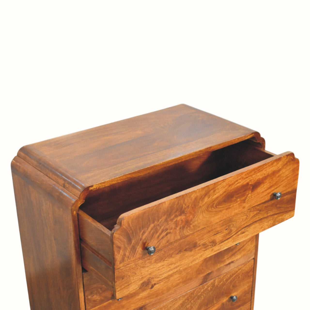 Wooden chest of drawers in dark brown, with open top drawer.