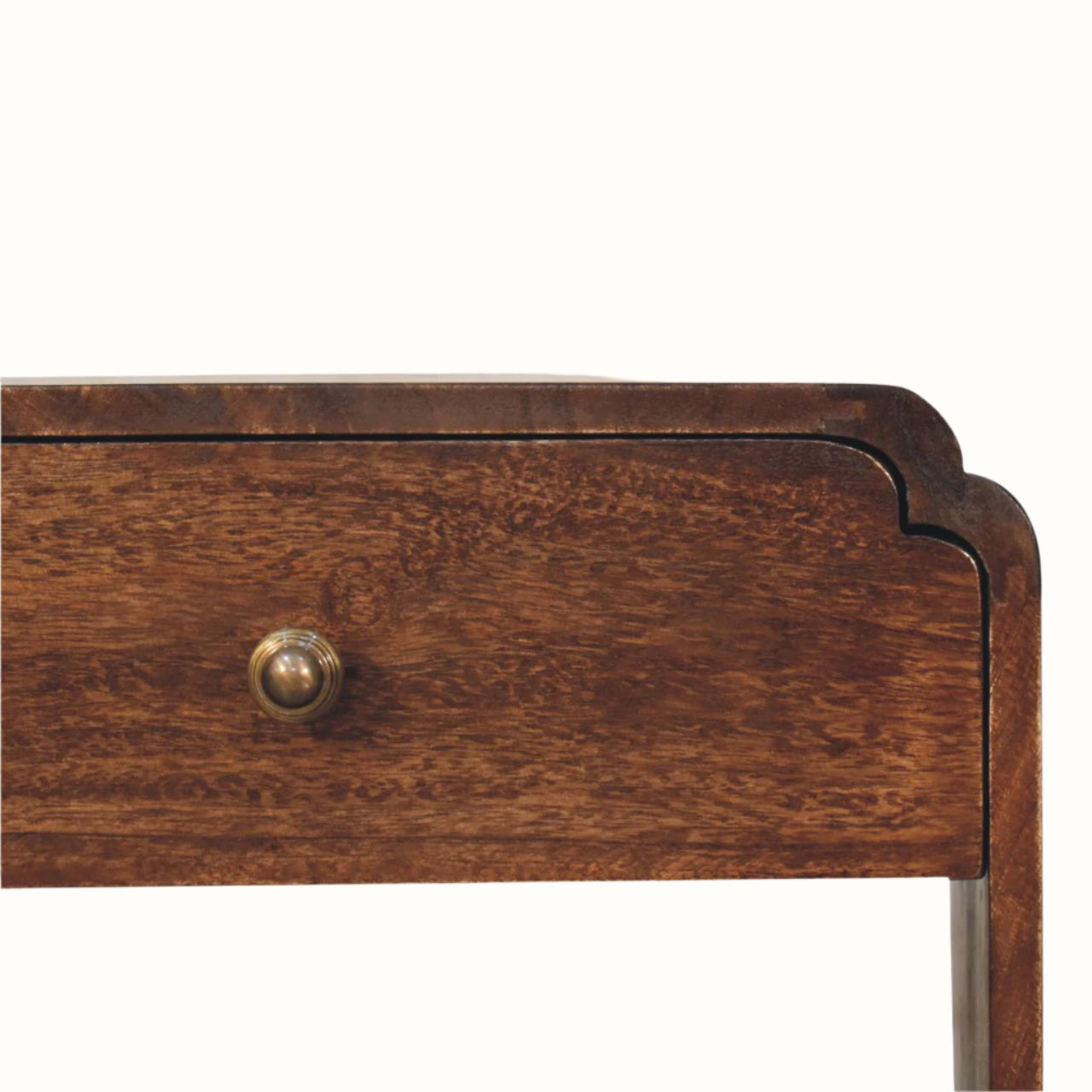 Close-up of a wooden drawer with a brass handle on a white background