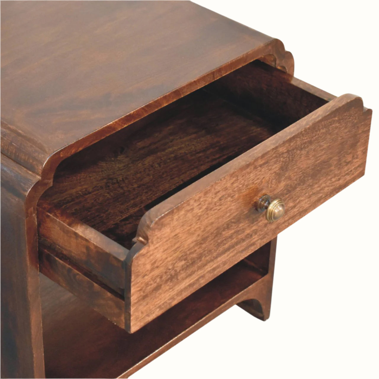 Wooden drawer with a brass handle on a white background