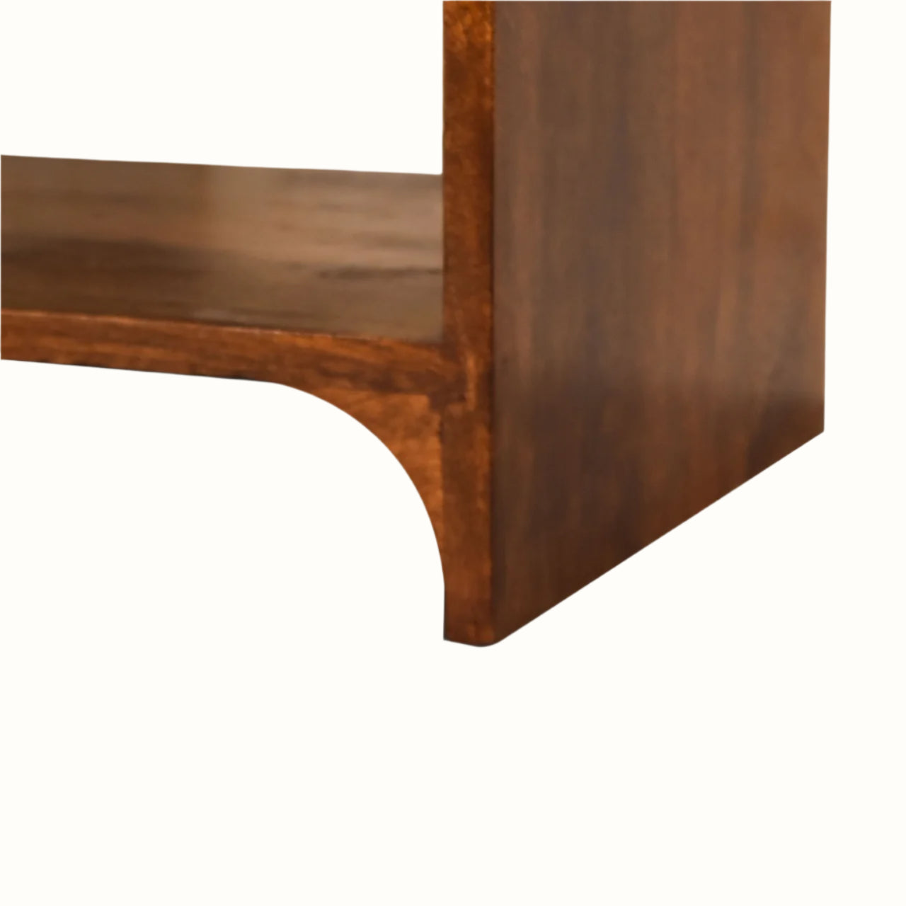 Close-up of a wooden bedside corner on a white background