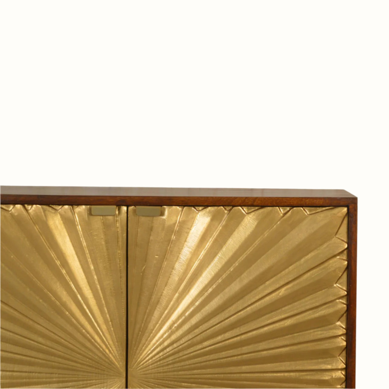 Gold leaf cabinet with a decorative pattern on a white background