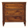 A three-drawer wooden chest of drawers with turned spindle legs and small round dark knobs, shown against a plain white background.