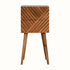 Small square bedside, with line carved pattern made from solid wood in a natural finish. 