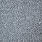 A close up photograph showing our black tweed sample.