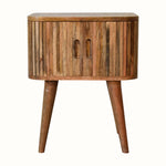 Striped wooden bedside table in a light wood finish.