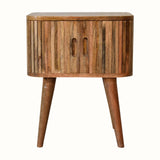Striped wooden bedside table in a light wood finish.