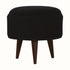 Circular footstool upholstered in black velvet, with dark wood legs.