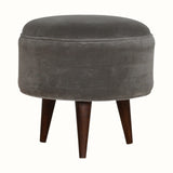 Round footstool upholstered in grey velvet. 
