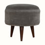 Round footstool upholstered in grey velvet. 