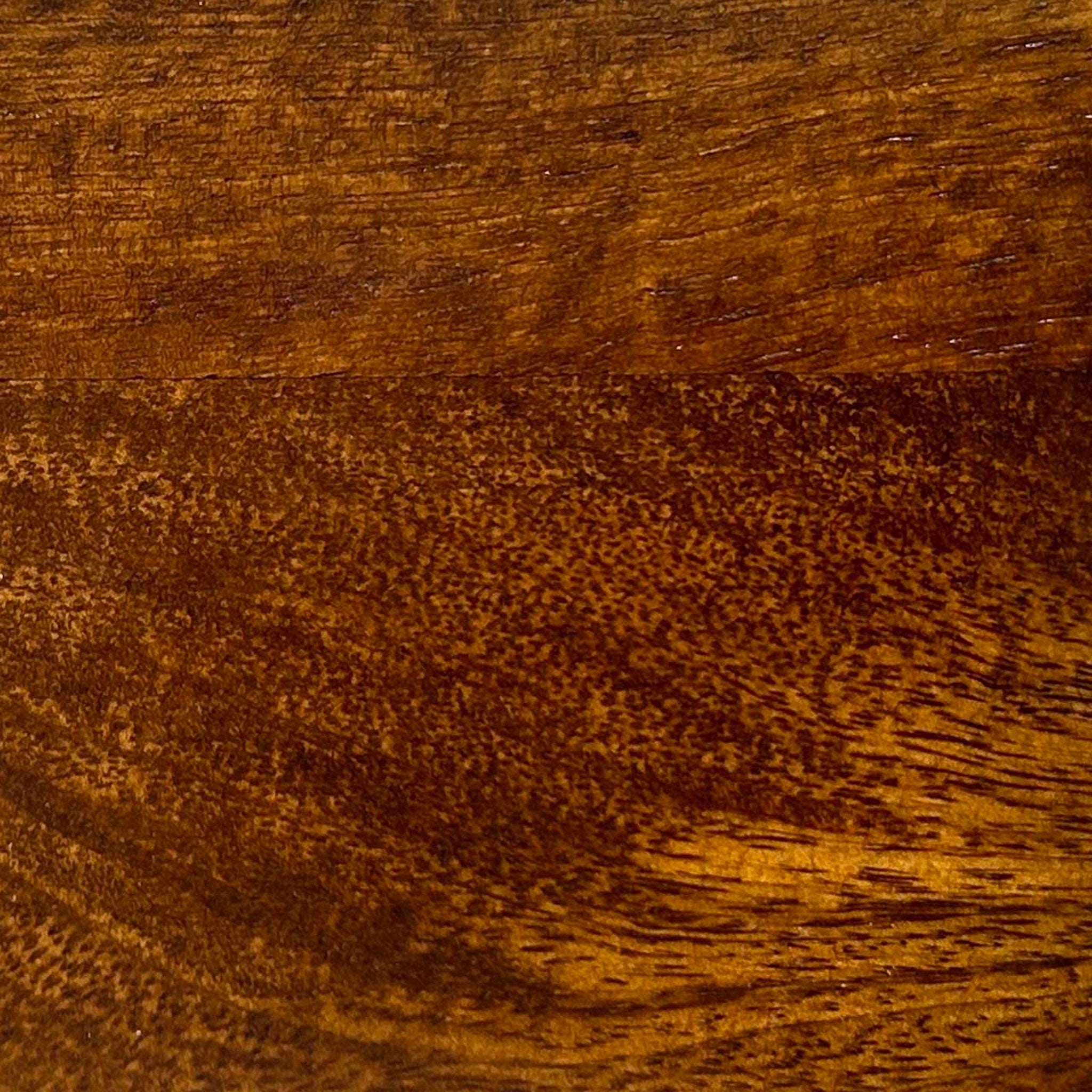 A close up photograph showing our chestnut mango wood sample.