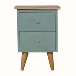 Small green bedside with two drawers and wooden legs on a white background