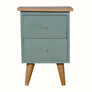 Small green bedside with two drawers and wooden legs on a white background