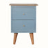 Hand-painted bedside table made from mango wood in a light blue finish. Nightstand features 2 drawers, brass metal hardware, and tapered legs.