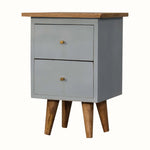 Small cabinet with two drawers and a wooden top on a white background