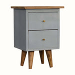 Small light blue cabinet with wooden legs and top on a white background