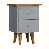Small light blue cabinet with wooden legs and top on a white background