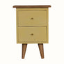 Hand painted wooden bedside table in a yellow finish, with 2 storage drawers, brass hardware and scandi-style legs.