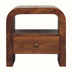 Rounded open bedside table with one storage drawer, handmade using solid wood in a dark brown chestnut finish.