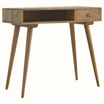 Desk crafted from mango wood in a light natural finish, with brass shell handle, a drawer and open slot shelf. 