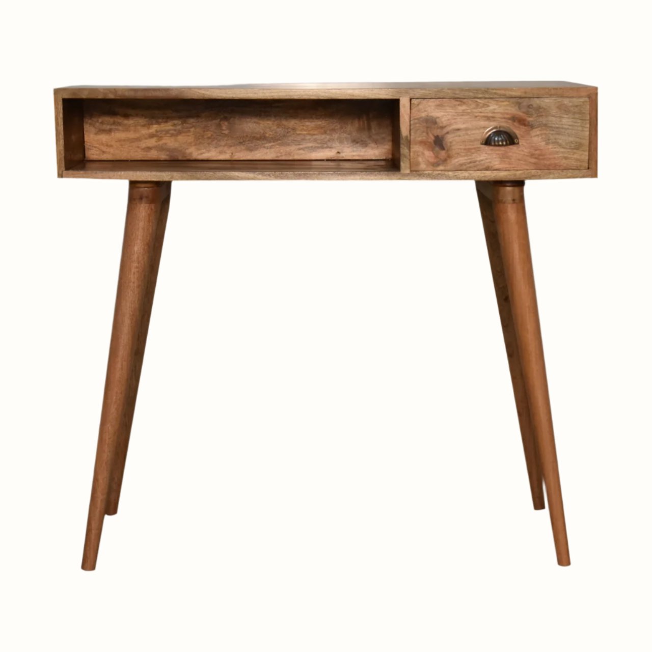 Desk crafted from solid mango wood in a light brown natural finish, with brass shell handle, one storage drawer and an open slot shelf. 