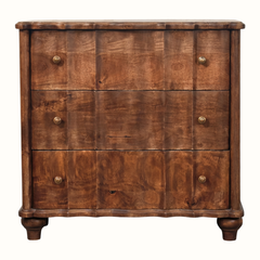 A rustic three-drawer wooden chest of drawers with a rich brown finish, featuring small round brass knobs and turned wooden feet, shown against a plain white background.