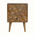 A medium-sized natural finish Felix bedside table with two drawers, featuring a textured cube-carved design, four Nordic-style legs, and brass knob detailing.