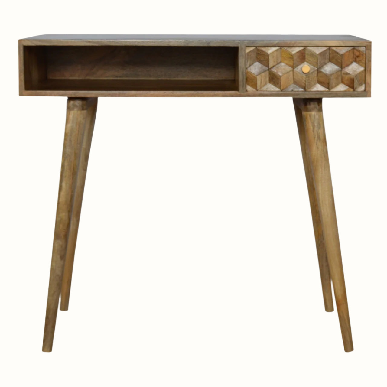 A natural finish mango wood writing desk with a textured cube-carved design, featuring a single drawer, four Nordic-style legs, and brass knob detailing.