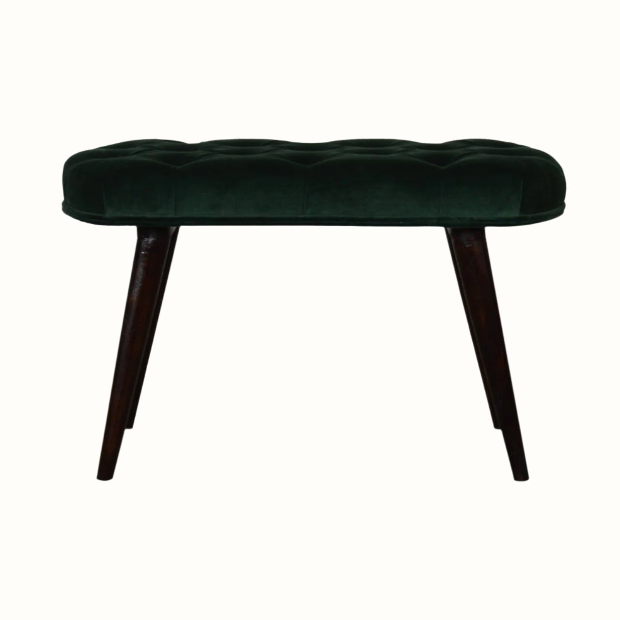 A emerald green velvet bench with walnut wooden legs, featuring deep button detailing.