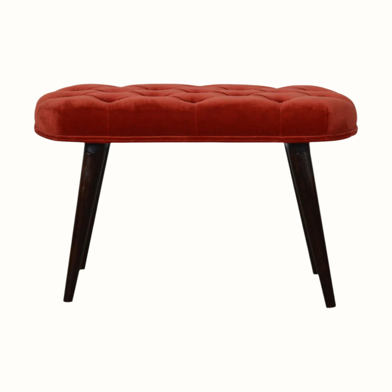 Curved stool with deep button top, upholstered in red fabric and dark wood legs. 