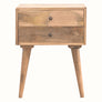 A natural finish mango wood bedside table with two drawers and brass knobs, featuring tapered legs.