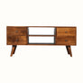 A brown wooden TV stand with four drawers and two open slot shelves, featuring brass knobs and short tapered legs.