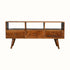 A dark wood TV stand with three drawers and open slots, featuring a traditional Norwegian design.