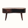 Wooden desk with a curved top and four legs on a white background