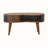 Curved coffee table made from wood in a dark brown finish.
