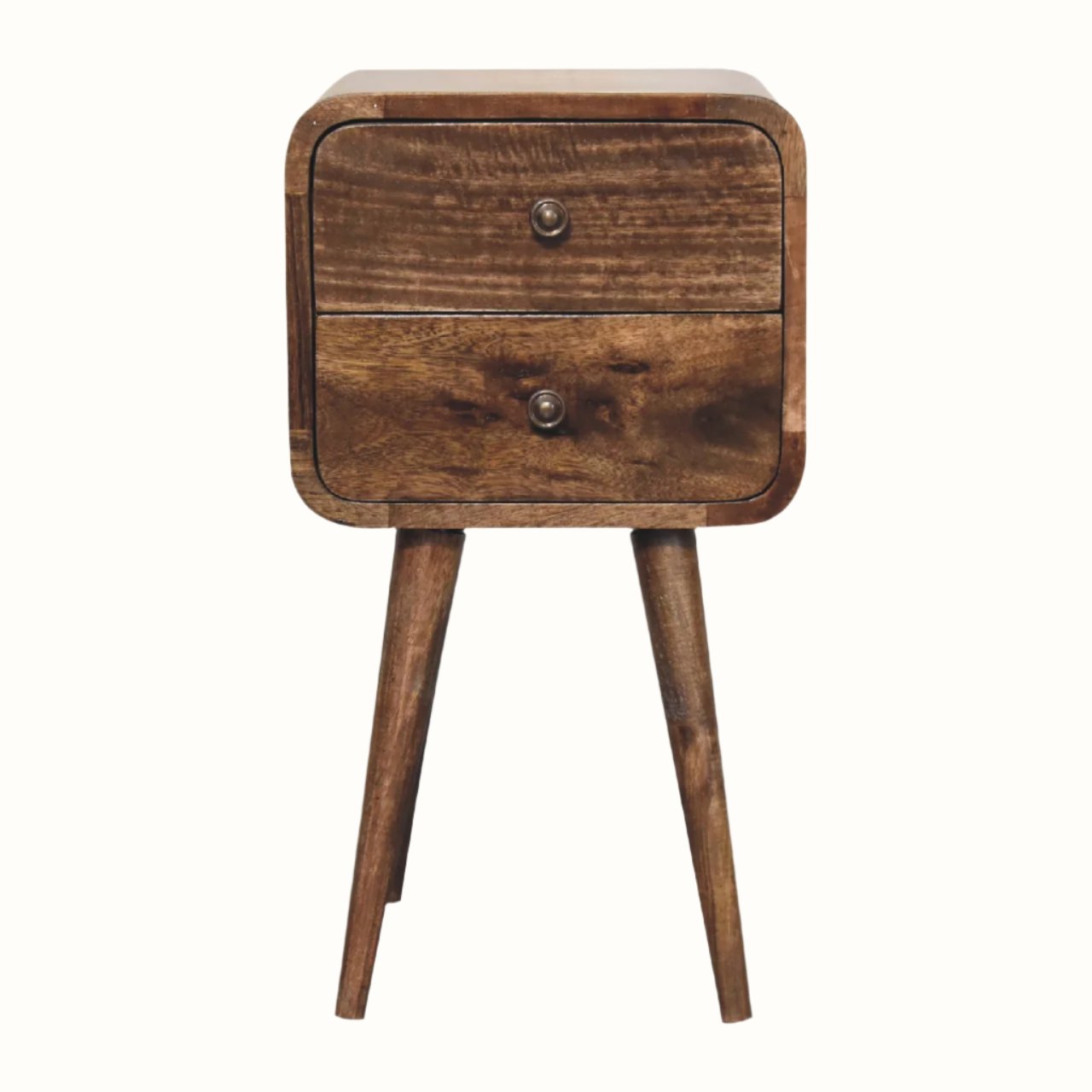 A small bedside table with four legs, made of mango wood with a grey wash finish, featuring two drawers with brass knobs.