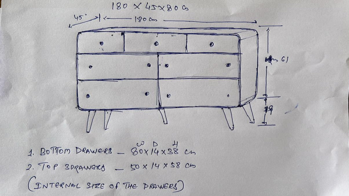 Hand-drawn blueprint of a dresser with dimensions on a piece of paper.