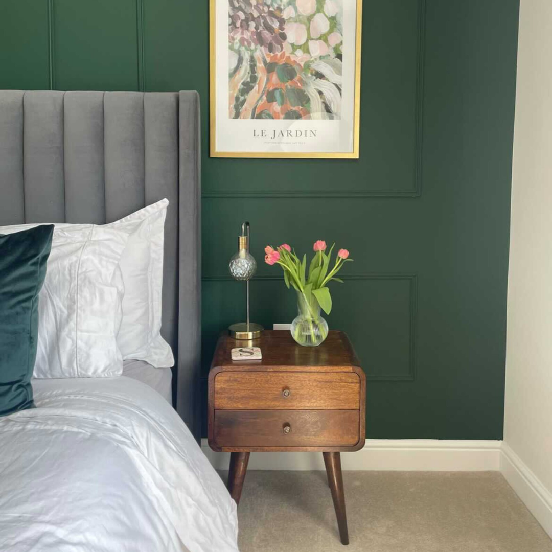 Stylish bedroom featuring a curved wooden bedside in a dark brown stain.