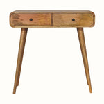 Light brown mango wood console table with curved edges, two drawers, brass knobs, and tapered legs.