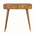 Light brown mango wood console table with curved edges, two drawers, brass knobs, and tapered legs.