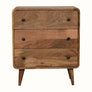 A small chest of drawers with a natural finish, featuring three horizontal drawers with brass knobs and a rectangular shape on four angled legs.