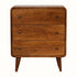 A small curved chest of 3 drawers in a dark wood stain.